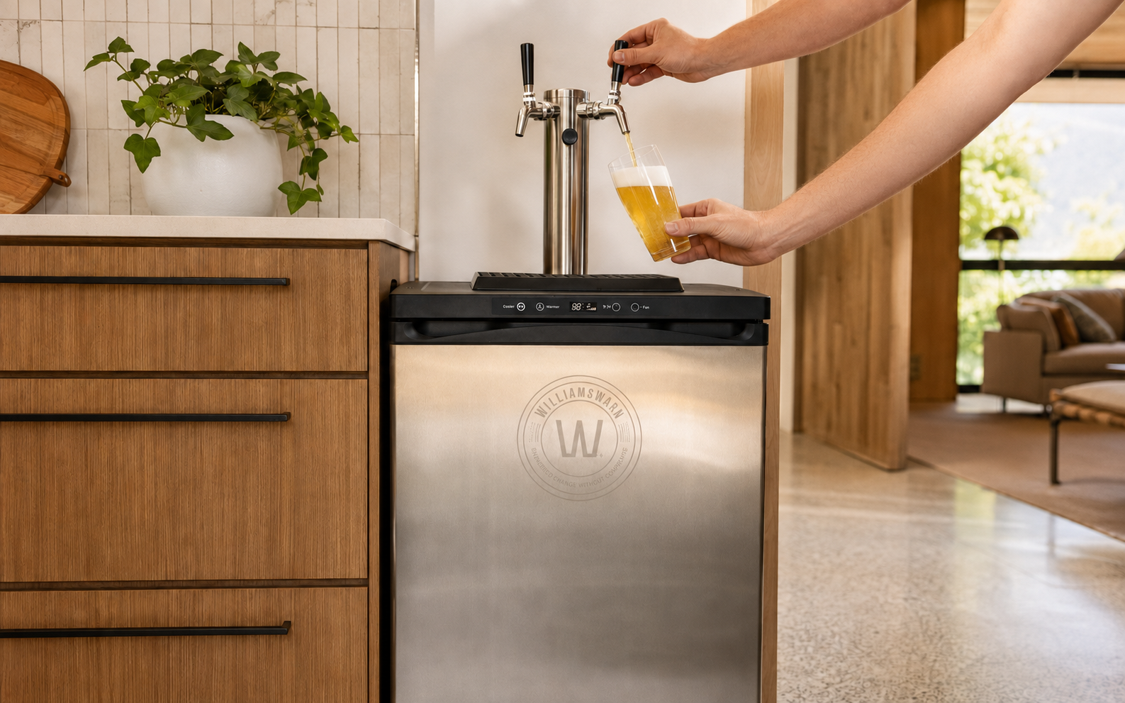 WilliamsWarn Kegerator pouring a fresh beer in a modern home